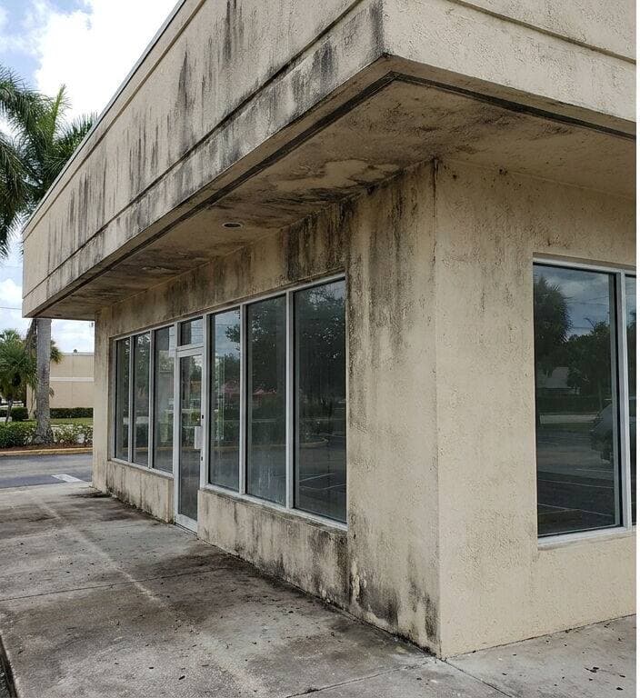 Commercial storefront exterior before pressure washing Miami